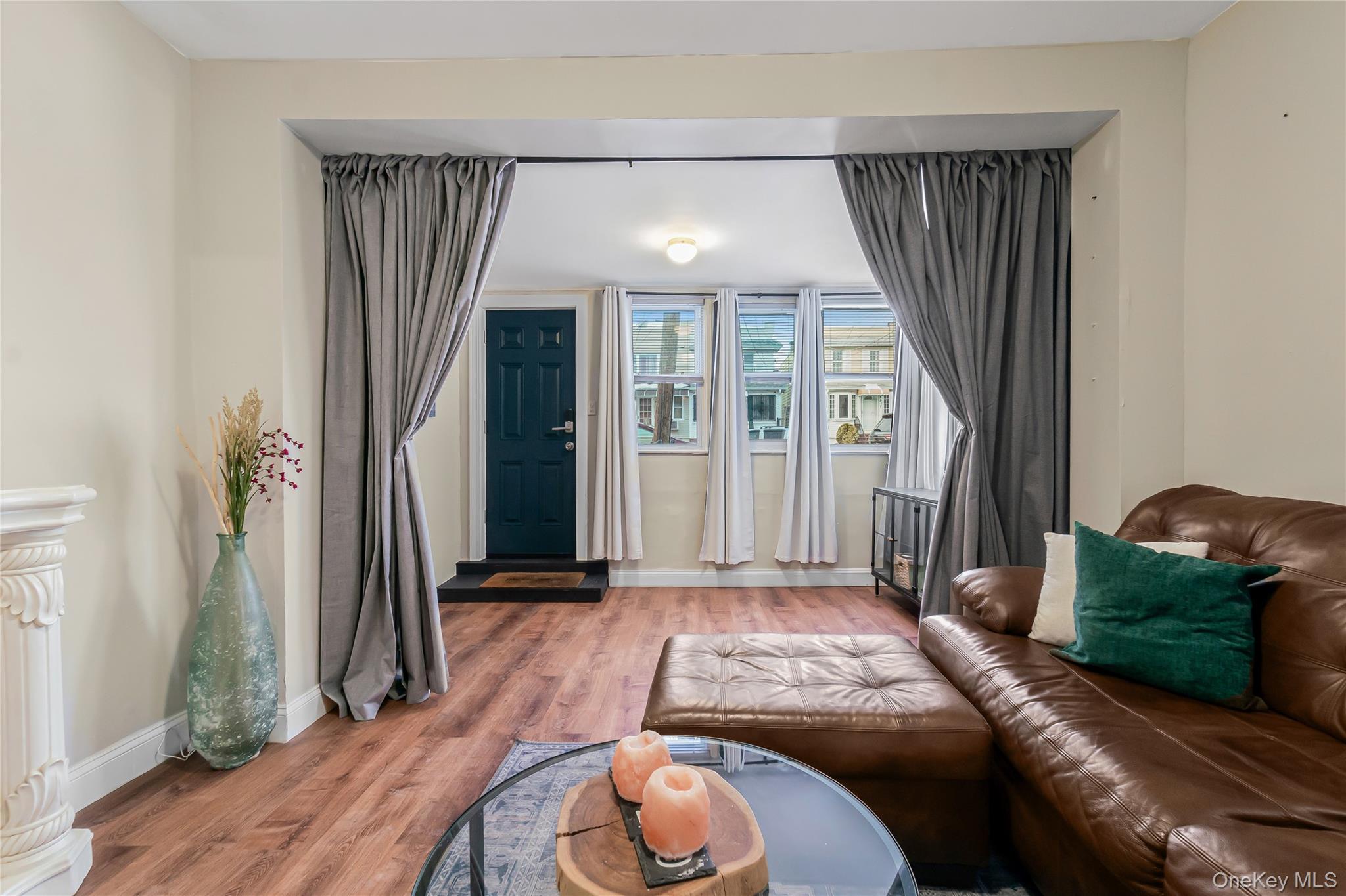 85-14 Sutter Avenue Queens, NY 11417 - Photo 3 of 27 Living area with wood finished floors and baseboards