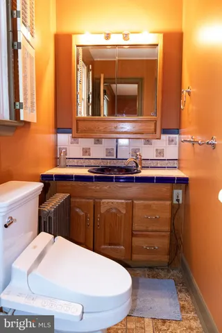 a bathroom with a toilet and a sink