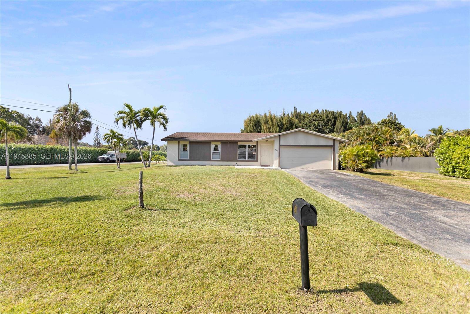 a house with swimming pool in front of it
