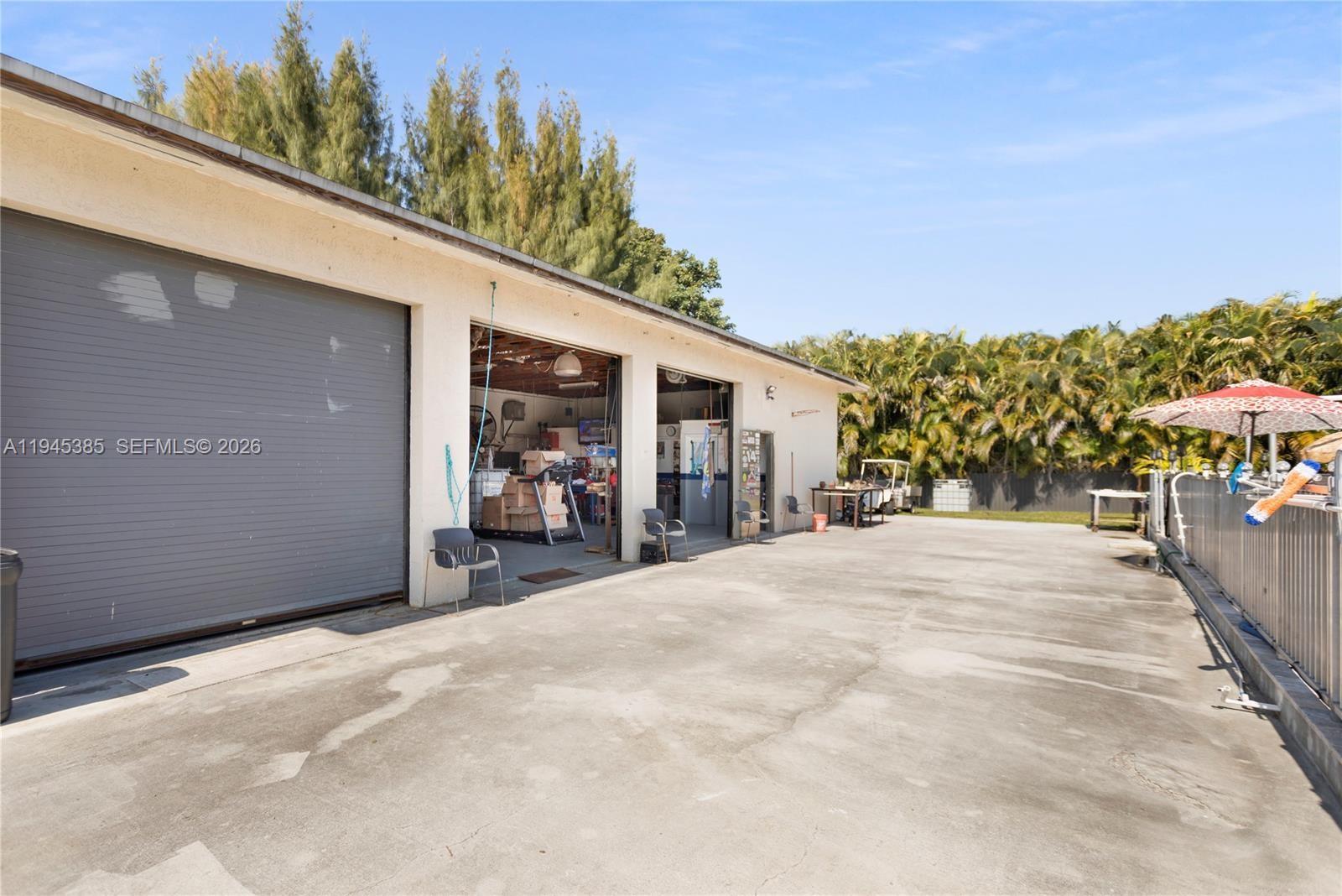 4841 Southwest 201st Terrace Southwest Ranches, FL 33332 - Photo 13 of 16 a view of a house with a patio