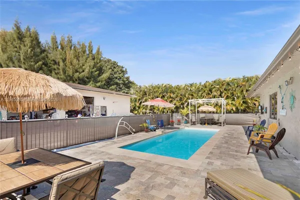 a view of a patio with swimming pool