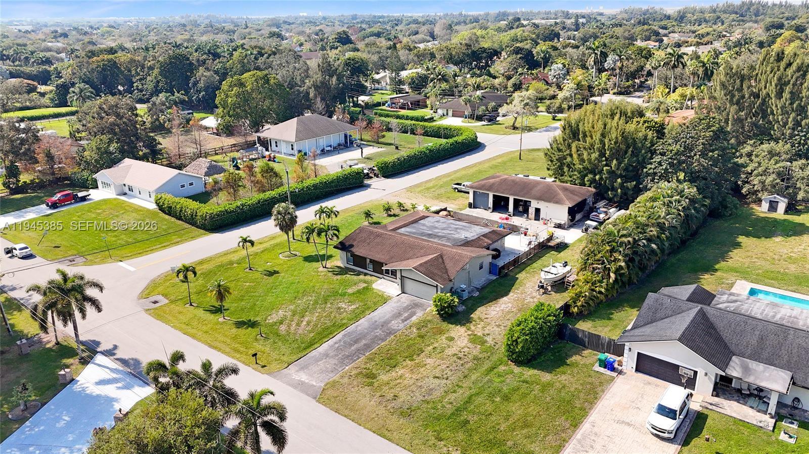 4841 Southwest 201st Terrace Southwest Ranches, FL 33332 - Photo 3 of 16 an aerial view of residential houses with outdoor space