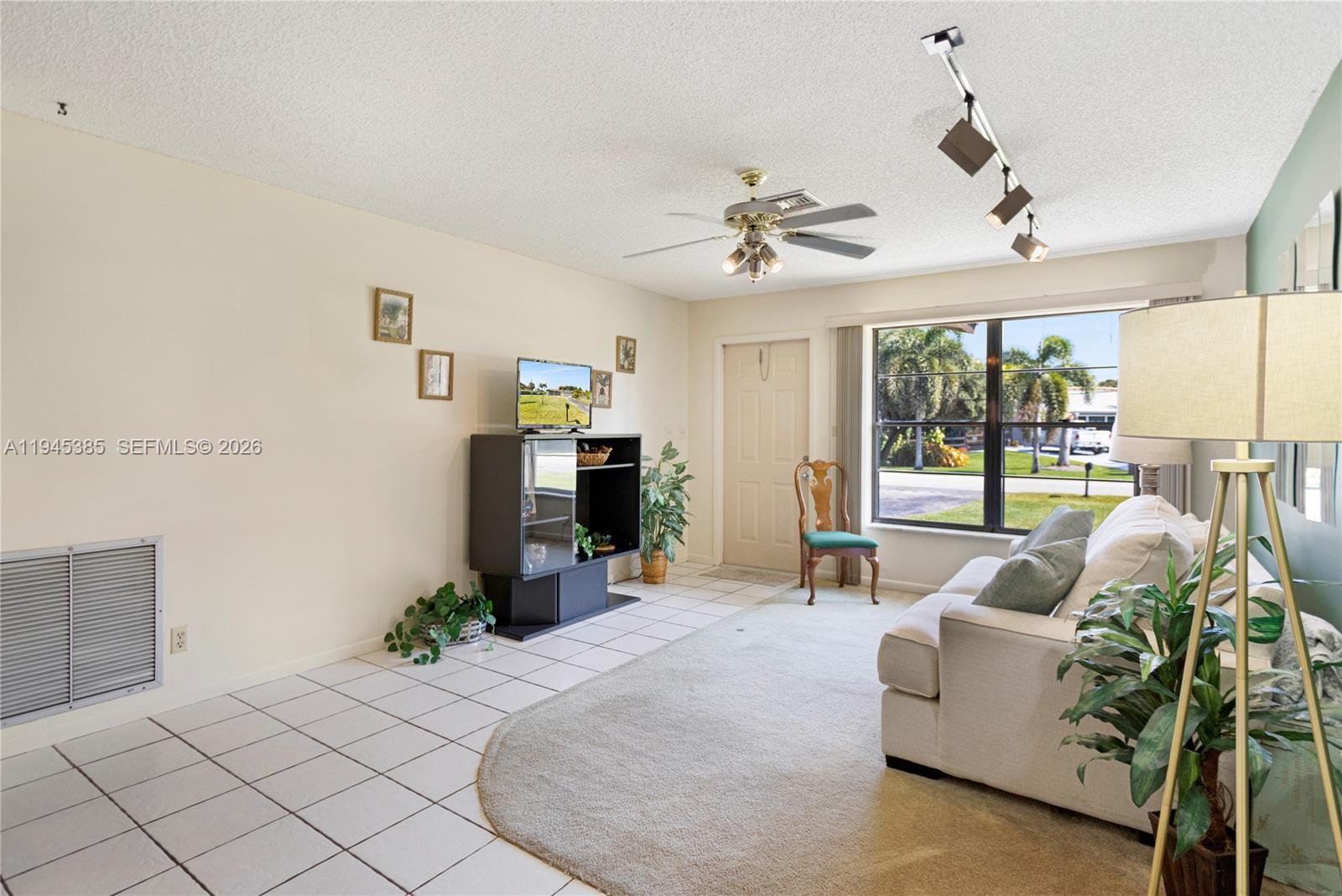4841 Southwest 201st Terrace Southwest Ranches, FL 33332 - Photo 7 of 16 a living room with furniture a large window with outer view