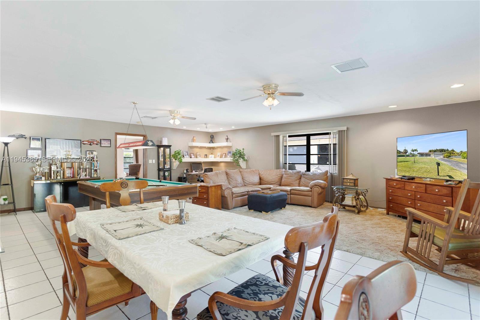 4841 Southwest 201st Terrace Southwest Ranches, FL 33332 - Photo 9 of 16 a living room with furniture and wooden floor