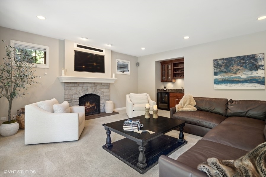 438 West 3rd Street Elmhurst, IL 60126 - Photo 13 of 43 a living room with furniture a flat screen tv and a fireplace