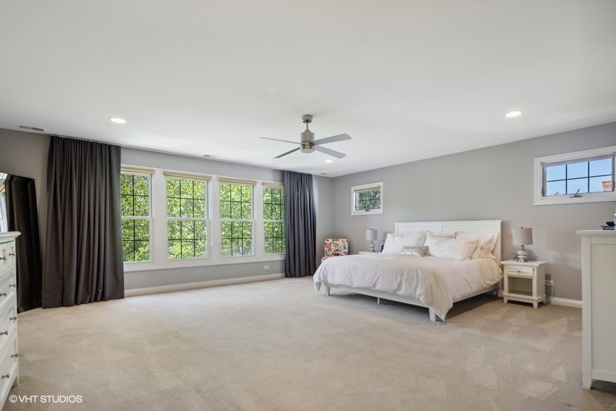 438 West 3rd Street Elmhurst, IL 60126 - Photo 20 of 43 a spacious bedroom with a bed and a large window