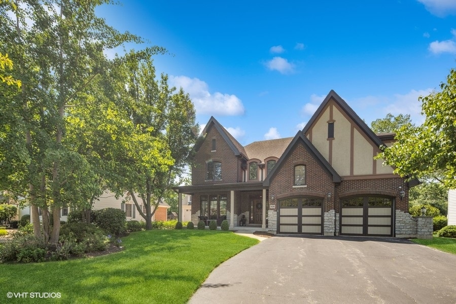 438 West 3rd Street Elmhurst, IL 60126 - Photo 2 of 43 a front view of a house with a yard and trees