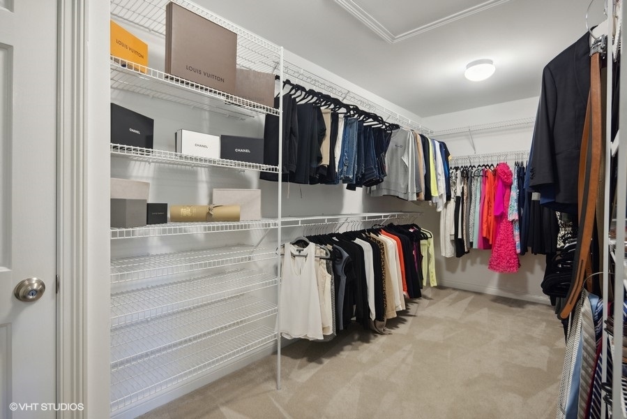 438 West 3rd Street Elmhurst, IL 60126 - Photo 23 of 43 a view of walk in closet with clothes and shoes
