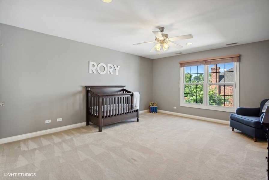 438 West 3rd Street Elmhurst, IL 60126 - Photo 29 of 43 an empty room with windows and ceiling fan
