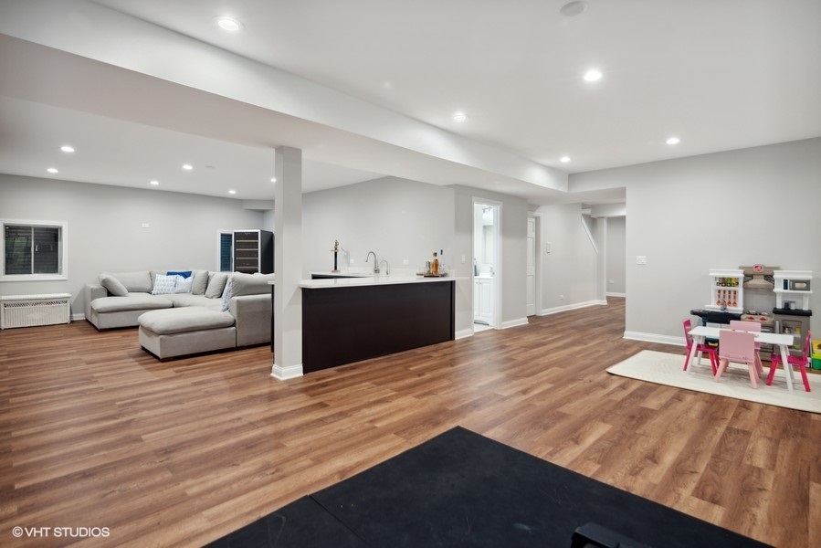 438 West 3rd Street Elmhurst, IL 60126 - Photo 34 of 43 a room with furniture and a wooden floor