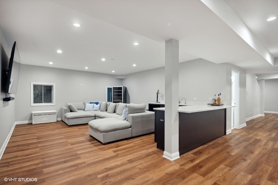 438 West 3rd Street Elmhurst, IL 60126 - Photo 35 of 43 a living room with furniture and a wooden floor