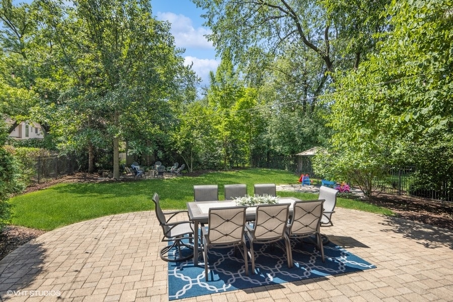 438 West 3rd Street Elmhurst, IL 60126 - Photo 38 of 43 a view of a patio with table and chairs potted plants and large tree