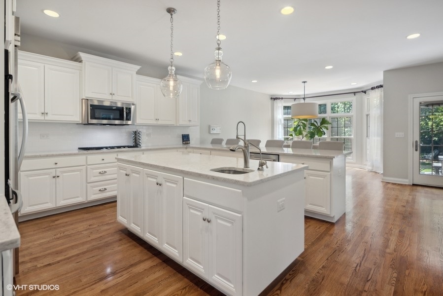 438 West 3rd Street Elmhurst, IL 60126 - Photo 10 of 43 a kitchen with a sink window and cabinets
