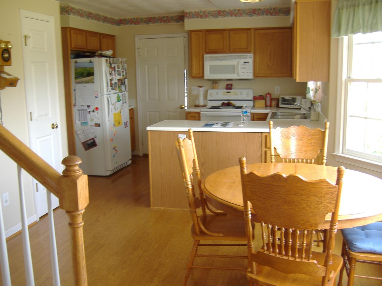 1420 Mill Iron Road Goodview, VA 24095 - Photo 4 of 26 a kitchen with stainless steel appliances granite countertop a sink and cabinets
