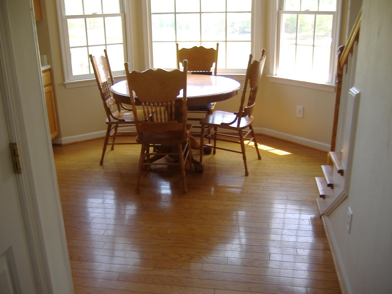 1420 Mill Iron Road Goodview, VA 24095 - Photo 5 of 26 a view of a dining room with furniture and wooden floor