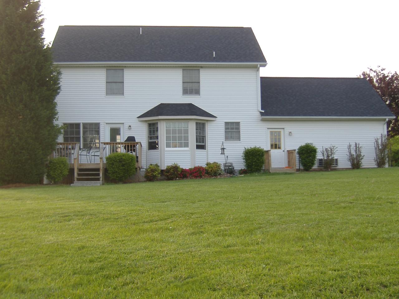 1420 Mill Iron Road Goodview, VA 24095 - Photo 7 of 26 a front view of a house with garden