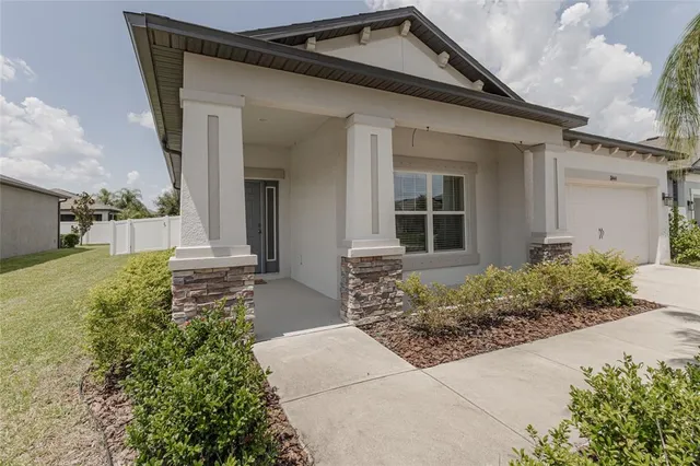 front view of a house with a yard