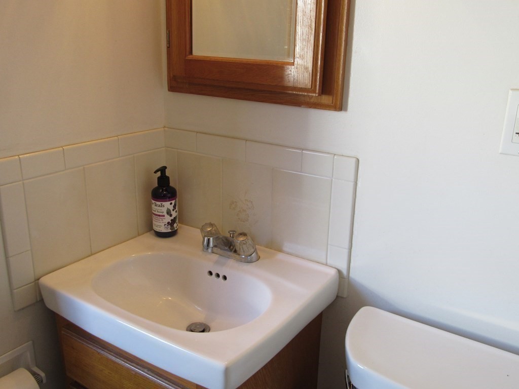 92 Hathaway Street Wareham, MA 02571 - Photo 16 of 29 a bathroom with a sink and a toilet