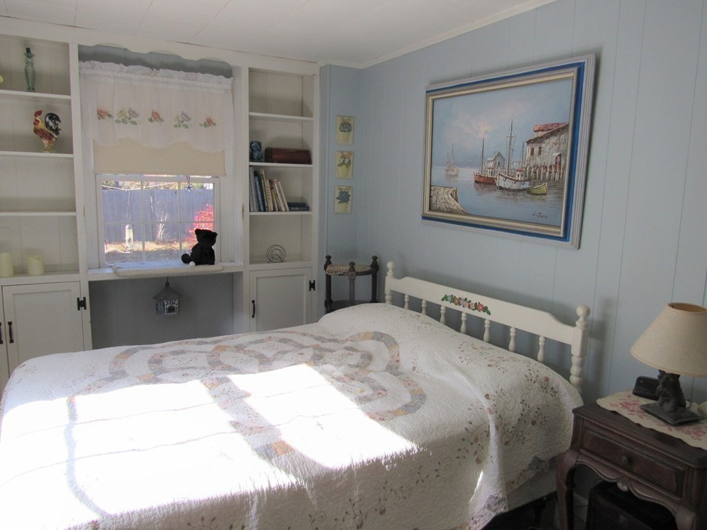 92 Hathaway Street Wareham, MA 02571 - Photo 19 of 29 a bedroom with a bed and a lamp on dresser