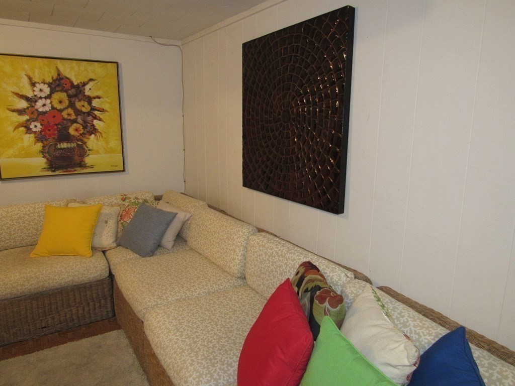 92 Hathaway Street Wareham, MA 02571 - Photo 20 of 29 a bed room with a bed and a painting on the wall