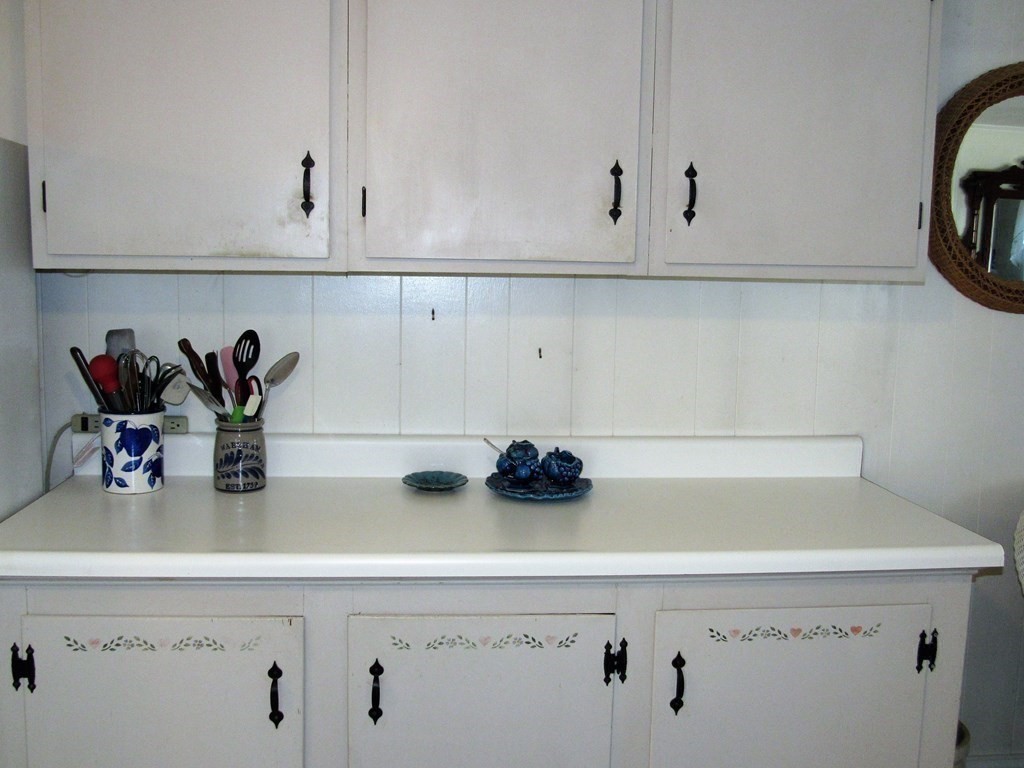 92 Hathaway Street Wareham, MA 02571 - Photo 6 of 29 a kitchen with a white cabinets and a stove