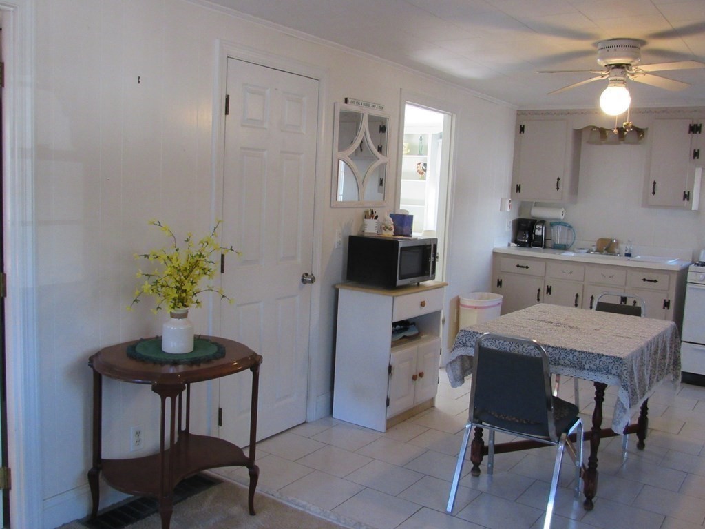 92 Hathaway Street Wareham, MA 02571 - Photo 7 of 29 a kitchen with a table and chairs in it