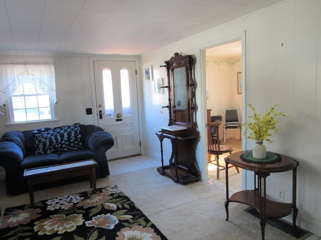 92 Hathaway Street Wareham, MA 02571 - Photo 9 of 29 a living room with furniture and a potted plant