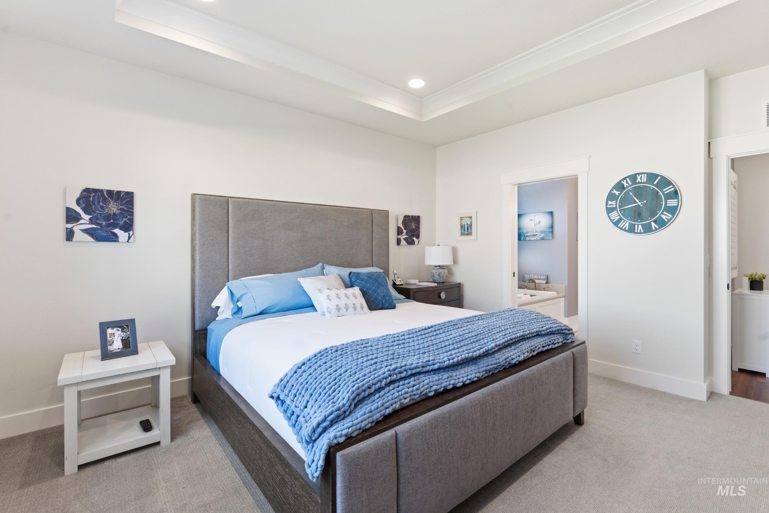 6347 South Utmost Lane Meridian, ID 83642 - Photo 21 of 37 Spacious room with plush carpeting and a tray ceiling featuring recessed lighting