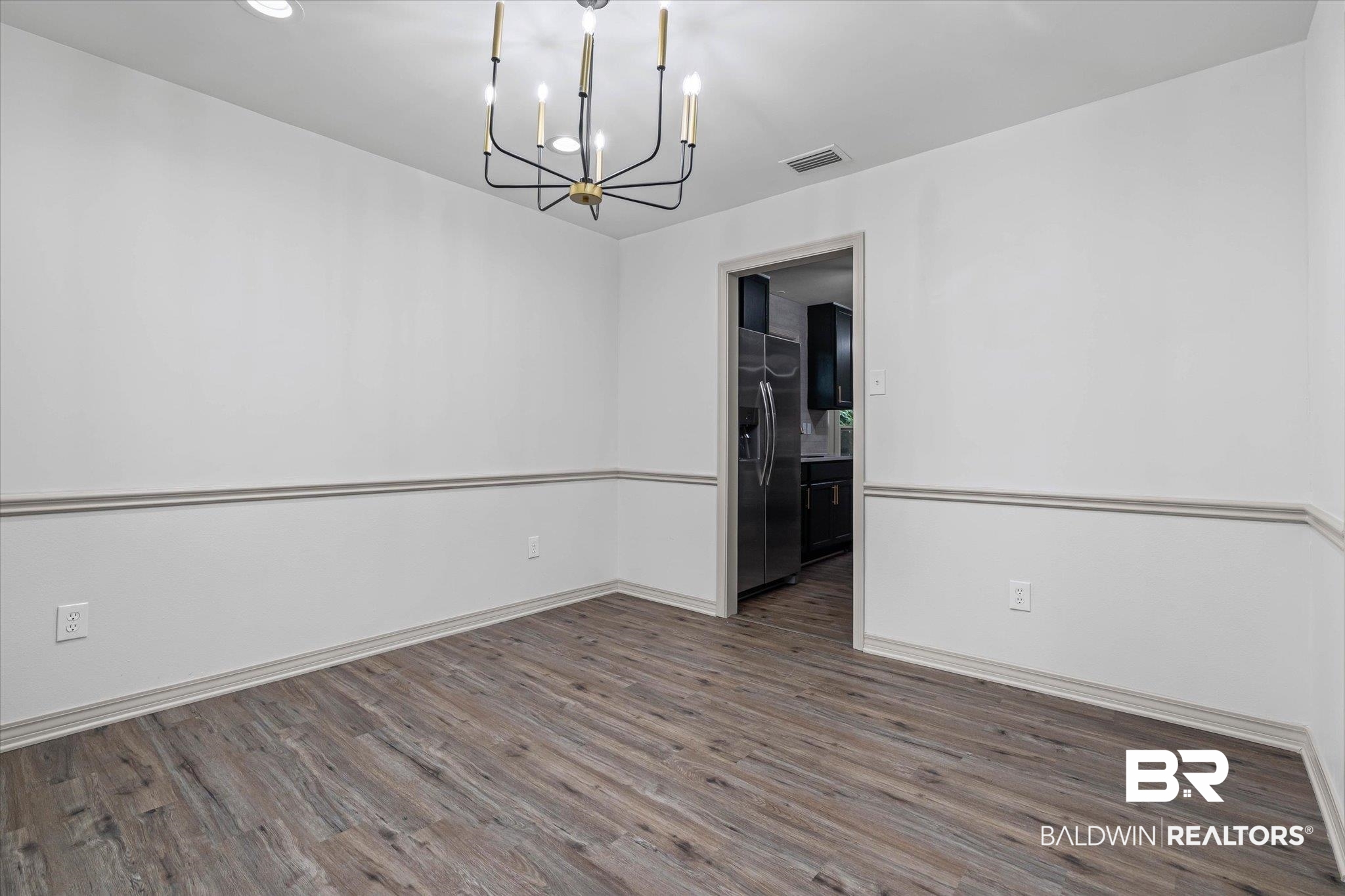 3655 Claridge Road South Mobile, AL 36608 - Photo 8 of 32 Spare room featuring dark wood-type flooring, a chandelier, and recessed lighting