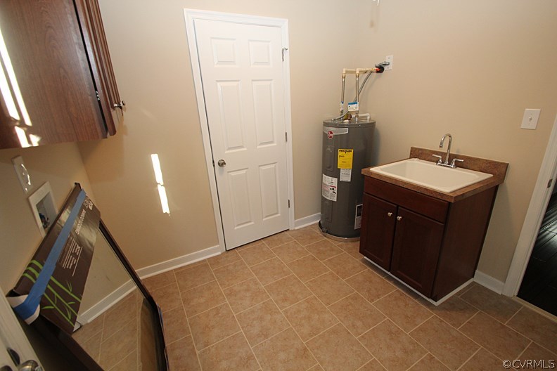 12401 Lewis Road Chester, VA 23831 - Photo 23 of 28 a bedroom with a sink and a mirror