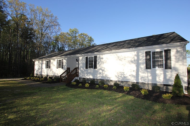12401 Lewis Road Chester, VA 23831 - Photo 3 of 28 a front view of a house with a yard