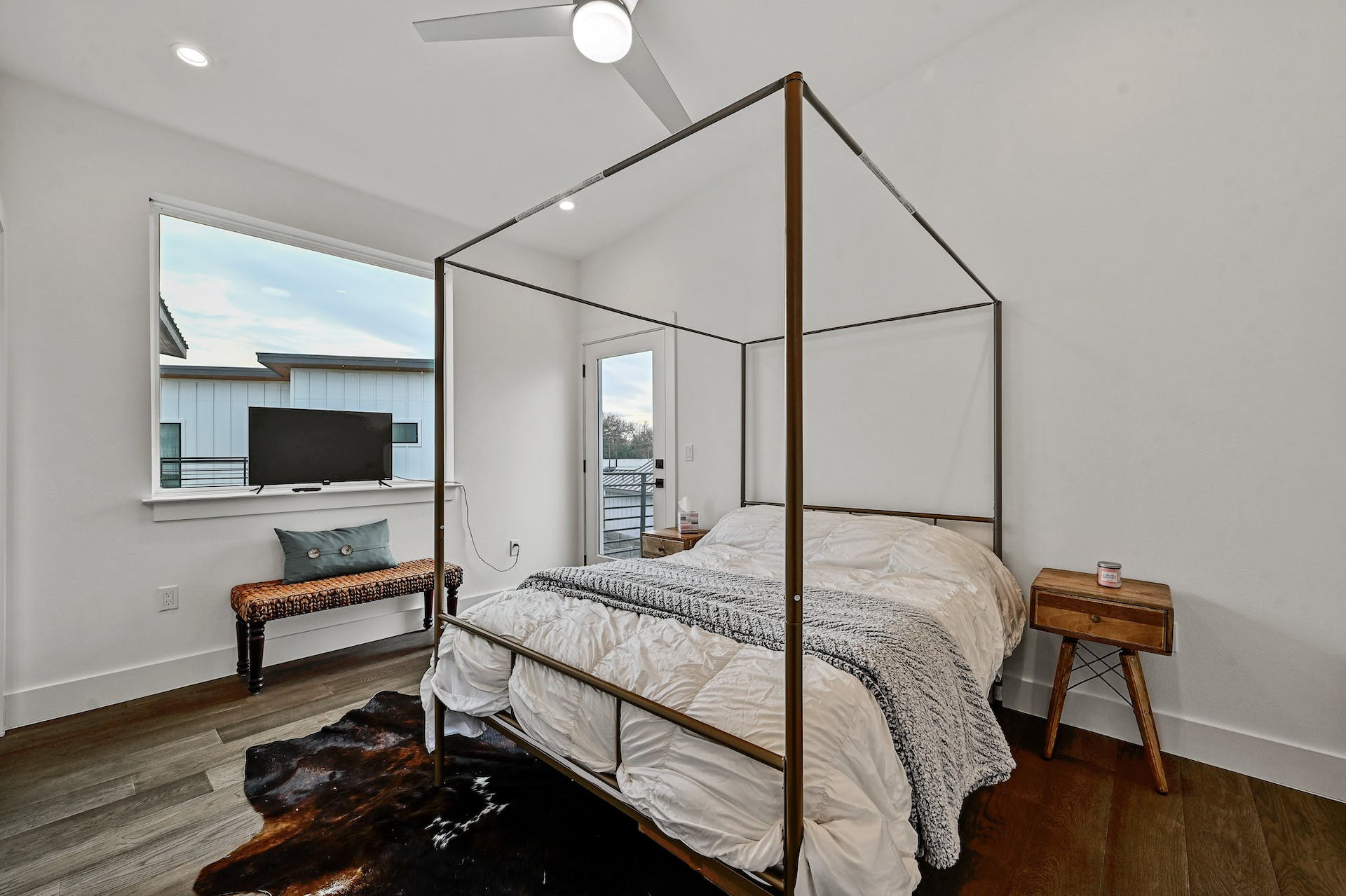 201 Tillery Square, Unit 2 Austin, TX 78702 - Photo 12 of 20 Primary bedroom with access to outdoor patio and large windows for natural light