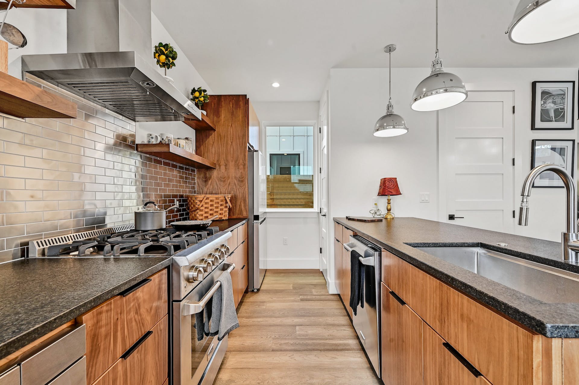 201 Tillery Square, Unit 2 Austin, TX 78702 - Photo 9 of 20 Galley kitchen with high-end appliances including gas cooktop