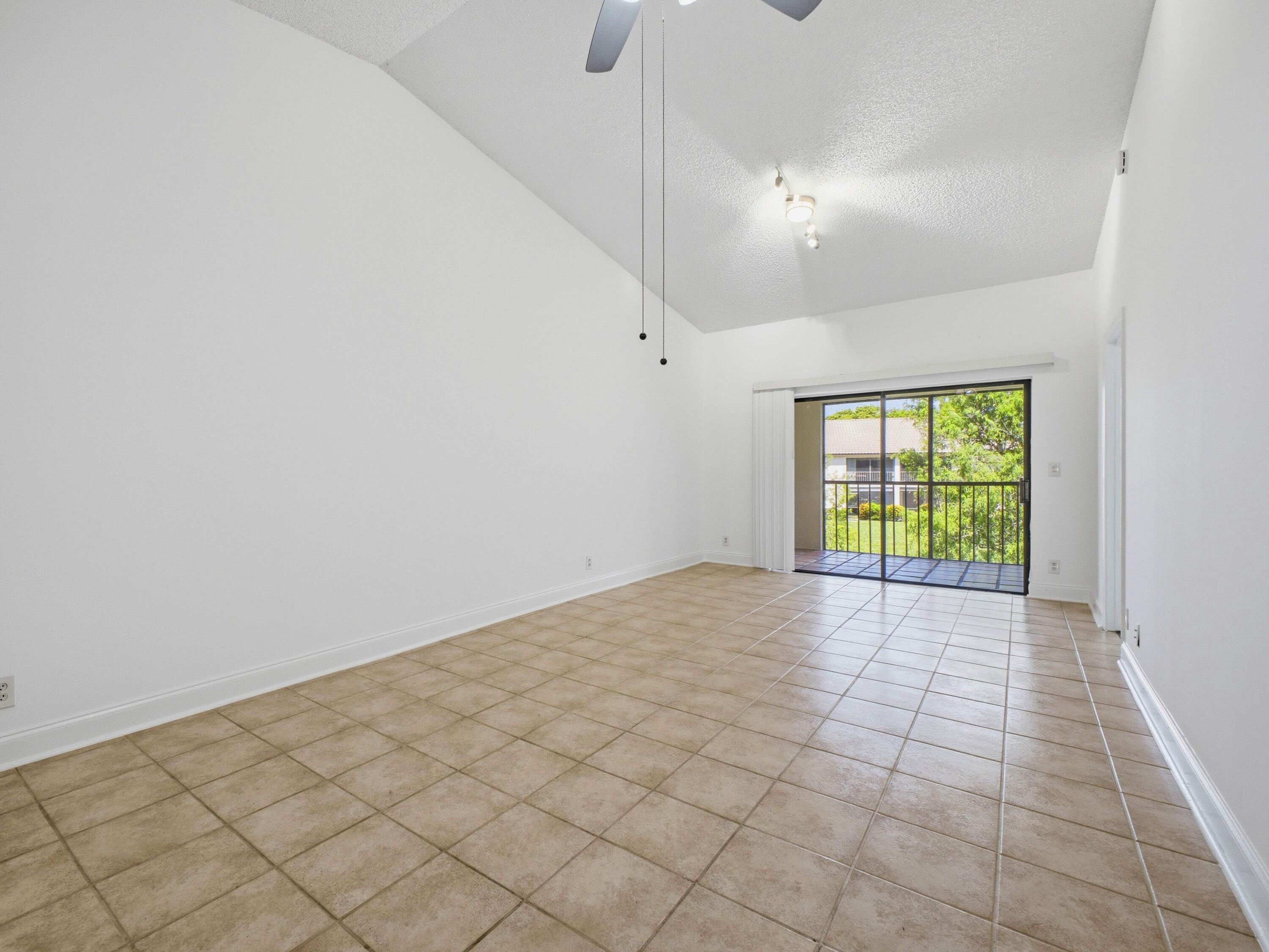 321 Norwood Terrace, Unit N221 Boca Raton, FL 33431 - Photo 13 of 36 Dining to Living Balcony