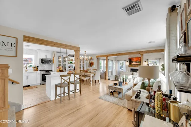 a living room with lots of furniture and a flat screen tv