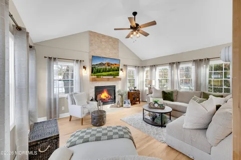 a living room with furniture and a fireplace