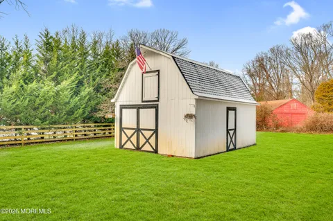 a view of a backyard with plants and a garden