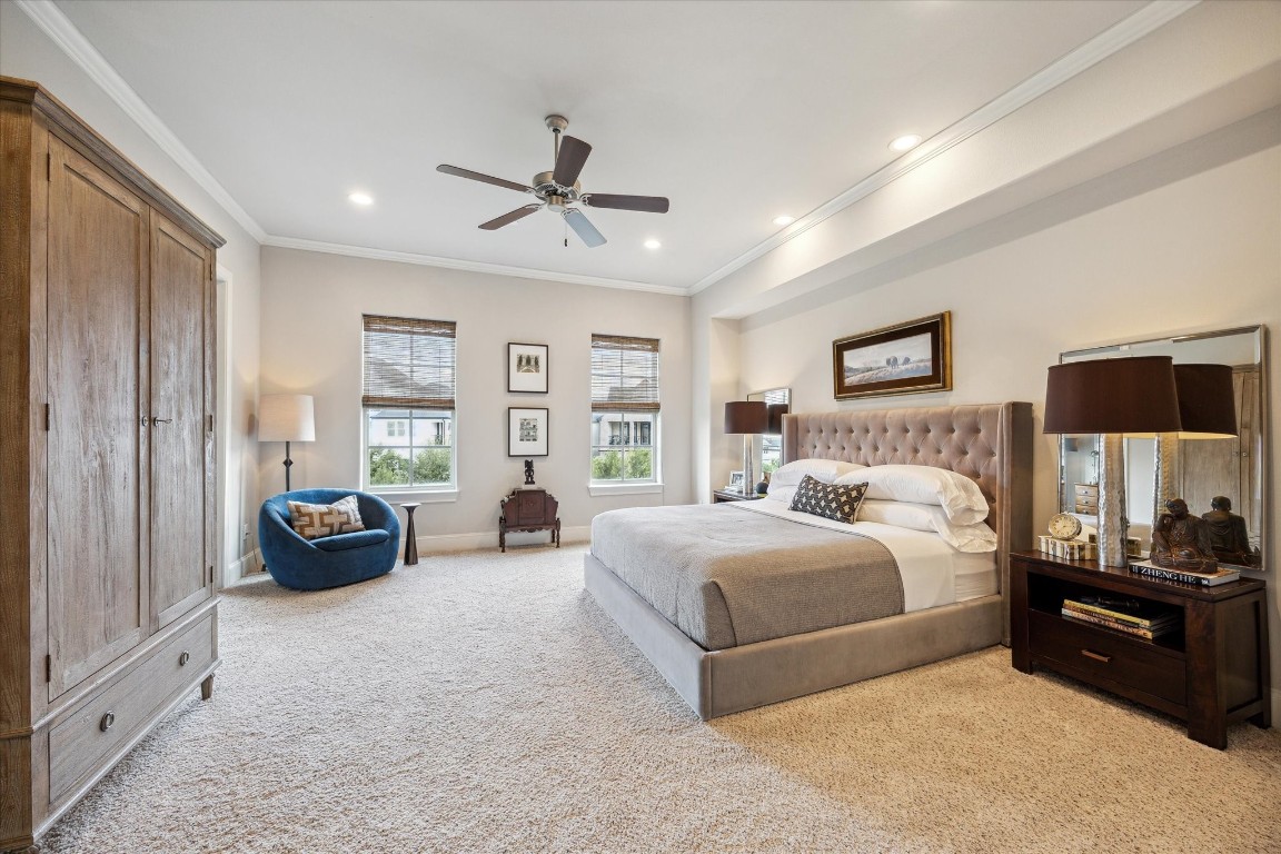9634 Kings Cross Station Houston, TX 77045 - Photo 12 of 24 PRIMARY BEDROOM – Huge primary suite with plush carpet and custom blinds.