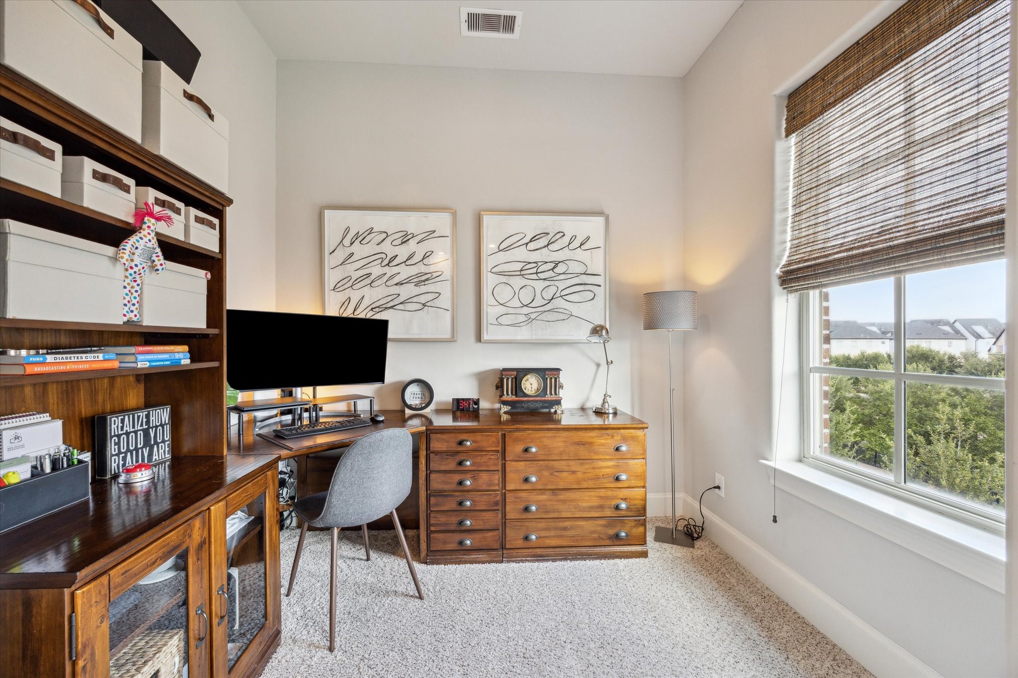 9634 Kings Cross Station Houston, TX 77045 - Photo 13 of 24 a view of a workspace with furniture and a window