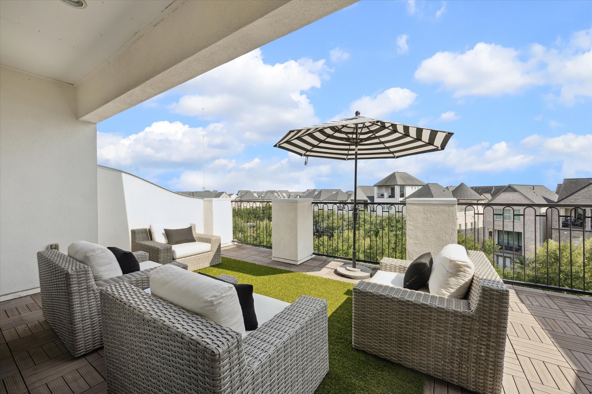 9634 Kings Cross Station Houston, TX 77045 - Photo 18 of 24 a living room with furniture a chandelier and a floor to ceiling window