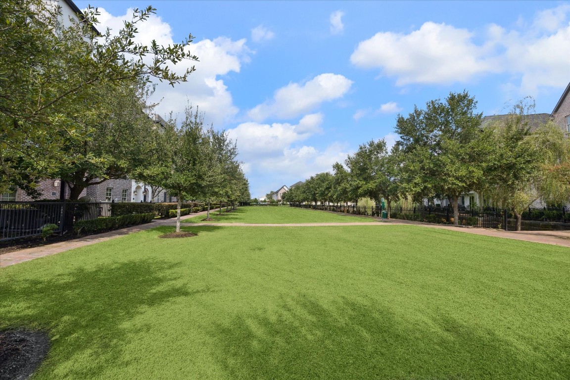 9634 Kings Cross Station Houston, TX 77045 - Photo 20 of 24 Lush tree-lined walkways and green spaces right outside your front door.