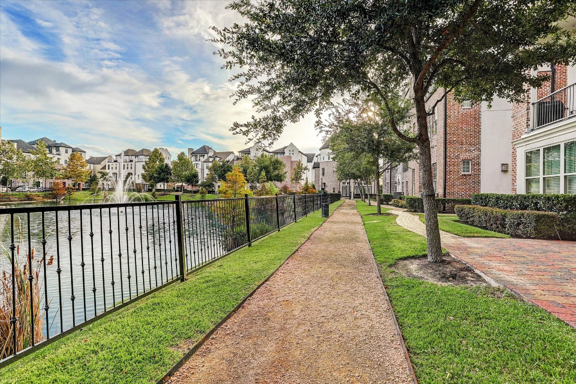 9634 Kings Cross Station Houston, TX 77045 - Photo 23 of 24 Well-maintained walking paths with beautiful landscaping.