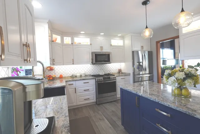 a kitchen with a table and chairs in it