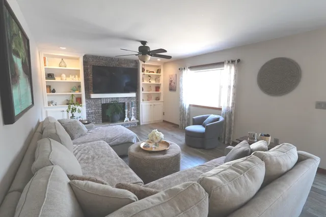 a living room with furniture and a large window
