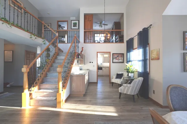 a view of living room with furniture and a chandelier