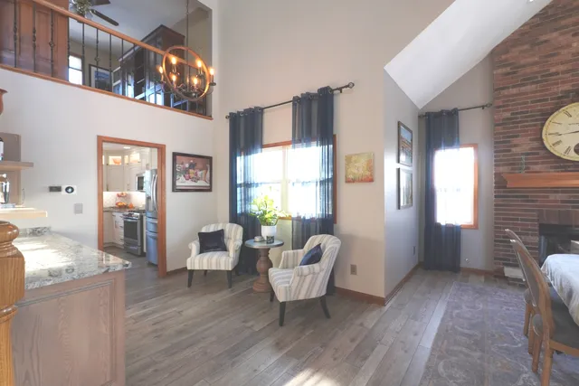 a view of an entryway wooden floor and windows