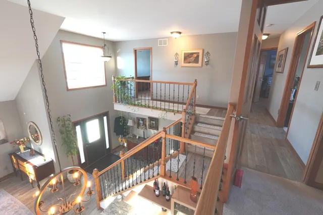 a view of a livingroom with furniture window and wooden floor