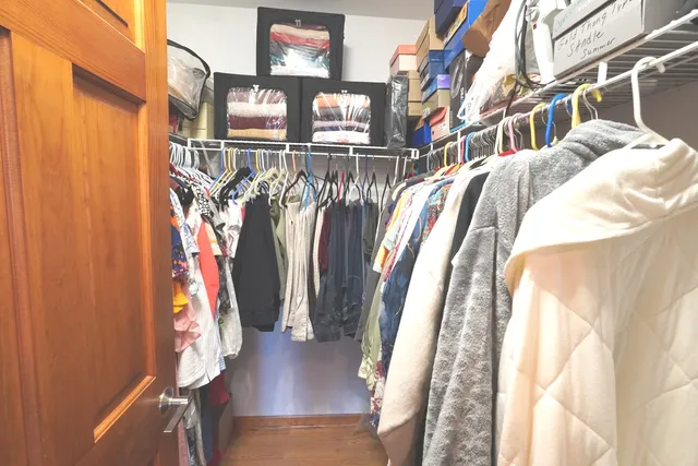 a bathroom with a granite countertop shower and a toilet