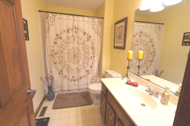 a room with a sink and a mirror