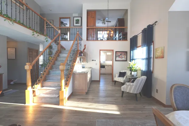 a view of entryway livingroom and hall with wooden floor